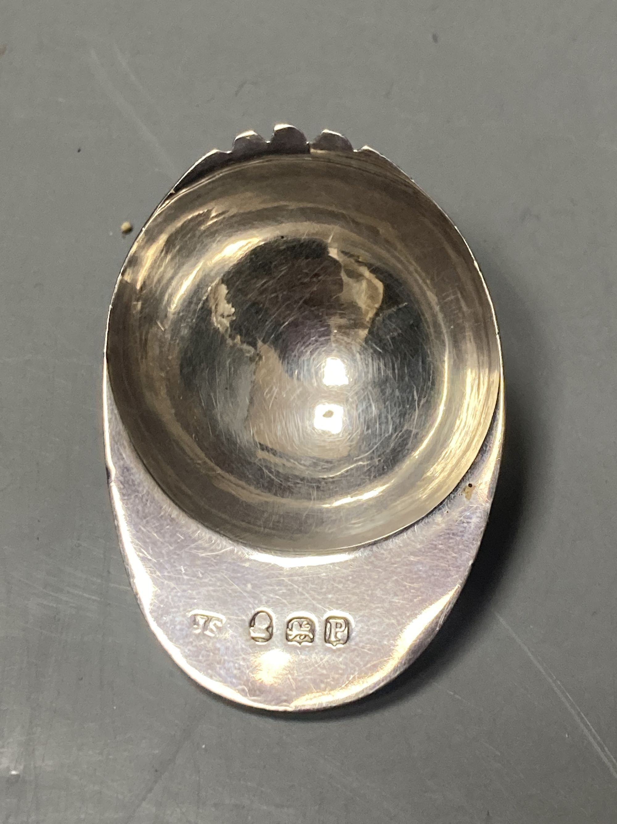 A George III engraved silver novelty caddy spoon, modelled as a jockeys cap, Josiah Snatt, London, 1810, 51mm.